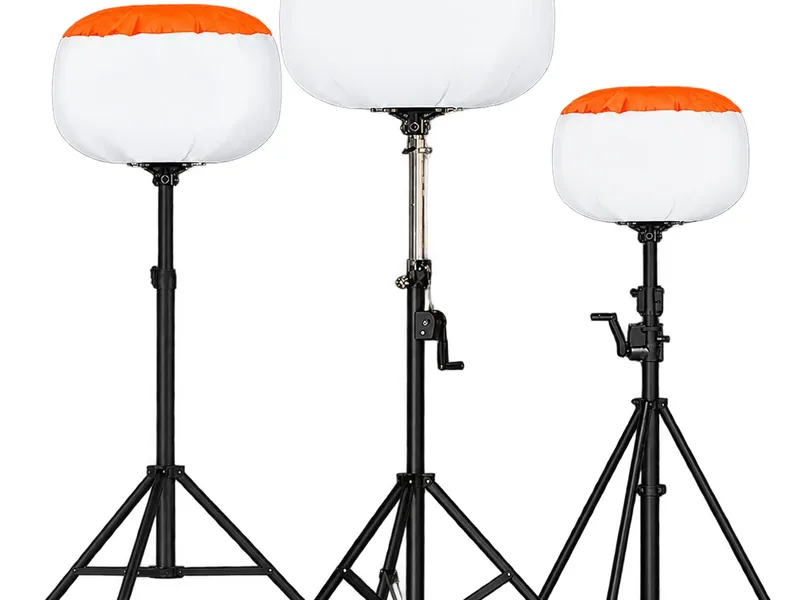Three white inflatable balloon light heads on black folding tripods, orange caps, white background